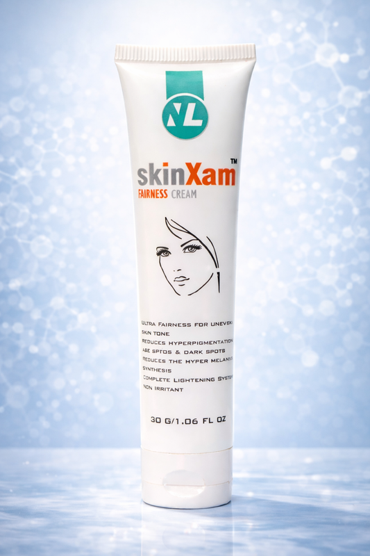 Tube of skinXam fairness cream on a light blue background