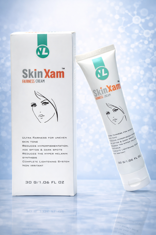 SkinXam fairness cream tube and packaging on a light blue background